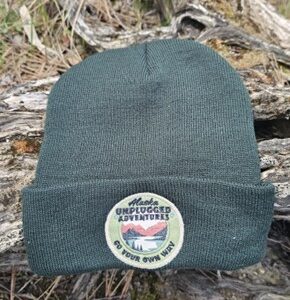 Green Beanie with Unplugged Adventures Circle Logo